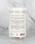 The back view of the container of Scentral Zone Shower Steamer in scent Lavendar + Rosemary explaining the ingredients and directions of how to use.