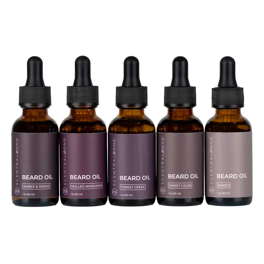 Scentral Zone 1oz assorted beard oils in amber colored dropper bottles with scents: amber & smoke, mulled mandarin, forest creek, sweet cigar, naked. These products are placed with a white background. 