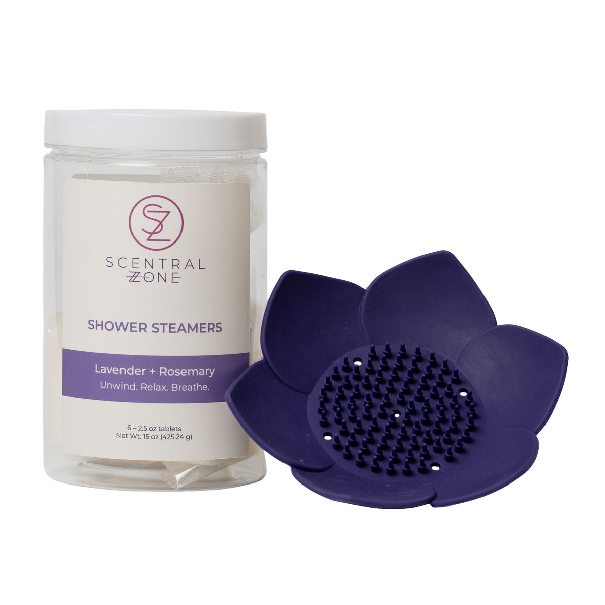 Scentral Zone Shower Steamer in scent Lavendar + Rosemary container with 6 tablets inside. To the right of the container is a purple lotus dish against a white background. 