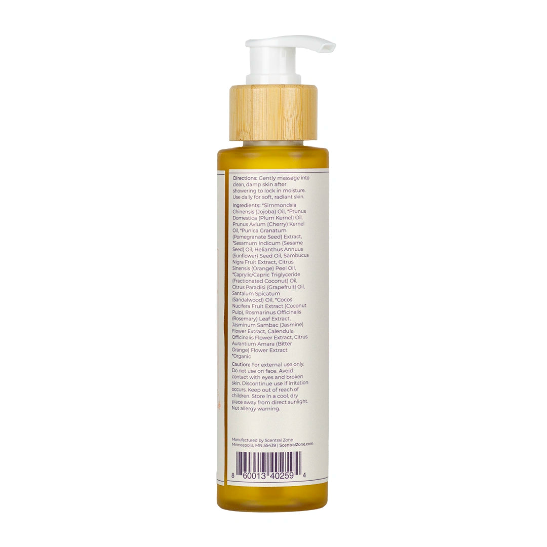 Back of Scentral Zone's Nourishing Body Oil in Orange Blossom Scent in a white bottle with a bamboo pump cover showing the product's ingredients and directions of application.