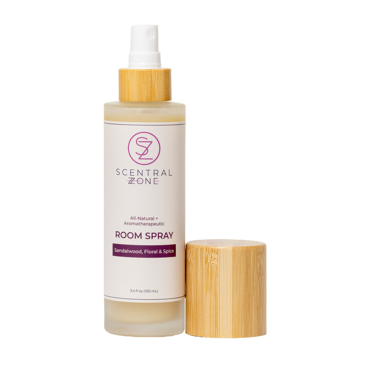 A bottle of Scentral Zone Room Spray in scent Scandalwood, Floral & Spice with a bamboo-look pump and a separate matching cap, shown on a clean white background.