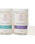 Scentral Zone Shower Steamers in two varieties: Peppermint + Eucalyptus for an uplifting, refreshing experience and Lavender + Rosemary for relaxation. Two clear jars of shower steamer tablets are displayed alongside a single white tablet.