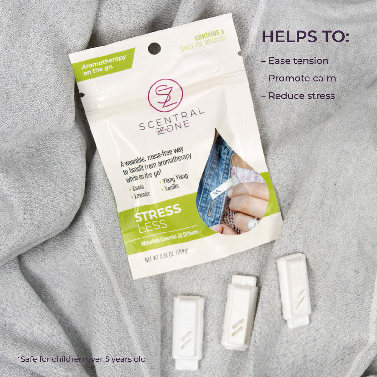 Scentral Zone Stress Less Diffuser pouch with a white and green design. Three clip-on diffusers are laid next to the pouch and text is displayed next to the pouch explaining the benefits. 
